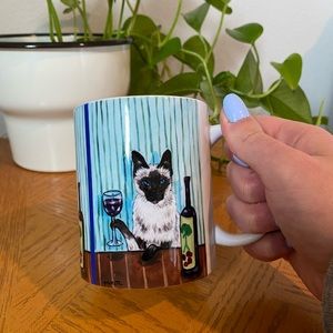 Siamese cat drinking wine coffee mug